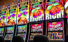 Online slot game reels spinning on a mobile device screen
